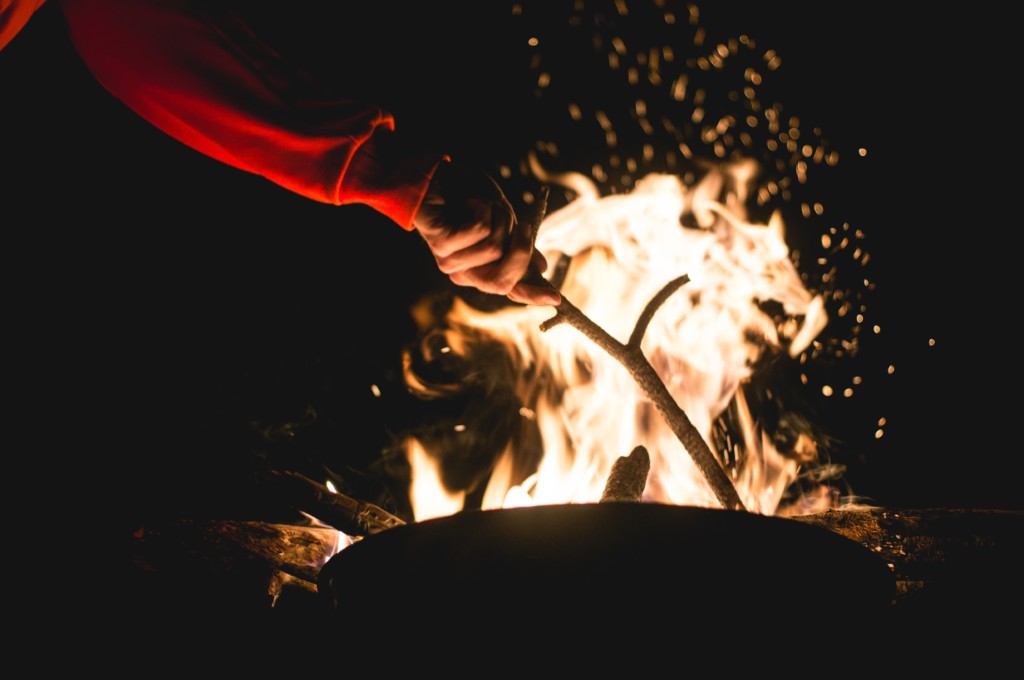 fire stoke stick stoking fire